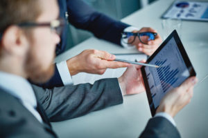 Retail Fuel Services Managers Reviewing Data on Tablet | McPherson Oil