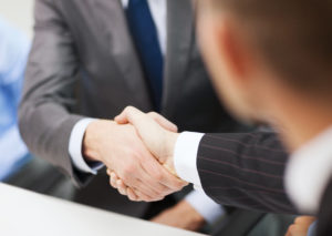 Business Partners Shaking Hands | McPherson Oil